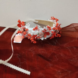 Pretty child headband with dried flower accents.