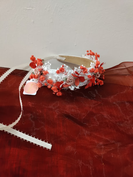 Pretty child headband with dried flower accents.